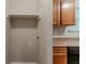 Convenient laundry area with built in shelf offers additional storage at 6114 Leverett Dr, Lithonia, GA 30038