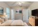 Spacious bedroom featuring vaulted ceilings, neutral decor, and ample natural light at 6114 Leverett Dr, Lithonia, GA 30038