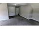 Cozy bedroom features neutral walls and carpeting, as well as a double closet for storage at 6385 Southland Forest Dr, Stone Mountain, GA 30087