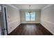 Elegant dining room with hardwood floors and a decorative chandelier at 6385 Southland Forest Dr, Stone Mountain, GA 30087