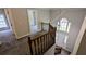 Bright foyer features hardwood stairs, a large window, and neutral paint at 6385 Southland Forest Dr, Stone Mountain, GA 30087