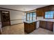 Spacious kitchen with tile floors and breakfast area. and wooden cabinets at 6385 Southland Forest Dr, Stone Mountain, GA 30087