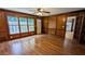 Wood paneled living room with hardwood flooring and access to the kitchen at 6385 Southland Forest Dr, Stone Mountain, GA 30087