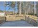 Inviting backyard view from the deck, showcasing the expansive yard and bordering trees for ultimate privacy at 13 Cliff Ct, Villa Rica, GA 30180