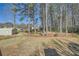 View of large backyard with established landscaping at 13 Cliff Ct, Villa Rica, GA 30180