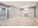 Finished basement with tiled flooring, neutral walls, and ample closet space at 13 Cliff Ct, Villa Rica, GA 30180