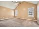 Neutral bedroom offering a spacious layout with two windows and plush carpeting at 13 Cliff Ct, Villa Rica, GA 30180