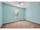 Bedroom featuring painted walls, a ceiling fan, and plush carpeting at 13 Cliff Ct, Villa Rica, GA 30180