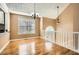 Inviting dining area features hardwood floors, abundant natural light, and elegant lighting at 13 Cliff Ct, Villa Rica, GA 30180
