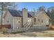 Home exterior featuring a cozy deck, fenced yard, and classic architectural details at 13 Cliff Ct, Villa Rica, GA 30180