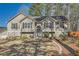 Charming home featuring a well-manicured front yard, stone accents and welcoming entrance at 13 Cliff Ct, Villa Rica, GA 30180