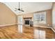Open living room featuring stone fireplace, hardwood floors and french doors at 13 Cliff Ct, Villa Rica, GA 30180