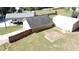 Aerial view of outbuildings featuring a carport with camper, storage building with fence and shed at 13 Cliff Ct, Villa Rica, GA 30180