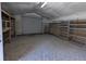 Spacious shed interior with gravel floor and metal shelving for optimal storage at 13 Cliff Ct, Villa Rica, GA 30180