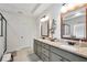 Bright bathroom featuring a granite countertop double vanity, decorative elements, and tiled floors at 220 Alcovy Reserve Way, Covington, GA 30014