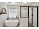 Luxurious bathroom featuring a standalone tub, glass-enclosed shower, and modern fixtures, creating a spa-like atmosphere at 220 Alcovy Reserve Way, Covington, GA 30014