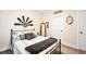 Bedroom features a window, shelf decor, and decorative windmill at 220 Alcovy Reserve Way, Covington, GA 30014
