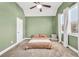 Relaxing bedroom with a vaulted ceiling, soft green walls, and abundant light at 220 Alcovy Reserve Way, Covington, GA 30014