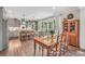 Open concept kitchen with bar seating, dining area, and view to outdoor living at 220 Alcovy Reserve Way, Covington, GA 30014