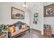 Cozy entryway featuring bench with pillows, stylish decor, hardwood floors, and a view to the front door at 220 Alcovy Reserve Way, Covington, GA 30014