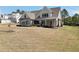Elegant two-story home with a covered porch and a beautifully landscaped lawn at 220 Alcovy Reserve Way, Covington, GA 30014
