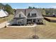 Stunning two-story home with a covered porch and a well-maintained lawn at 220 Alcovy Reserve Way, Covington, GA 30014