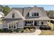 Inviting two-story home with a covered porch and a swing for relaxing at 220 Alcovy Reserve Way, Covington, GA 30014
