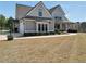 Gorgeous two-story house with a landscaped front yard and a covered porch at 220 Alcovy Reserve Way, Covington, GA 30014