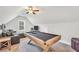 Spacious game room with a pool table, comfortable seating, and entertainment area at 220 Alcovy Reserve Way, Covington, GA 30014