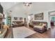 Spacious living room with fireplace, vaulted ceiling and leather furniture at 220 Alcovy Reserve Way, Covington, GA 30014