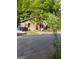 Cozy house with red door nestled in lush greenery, offering a private and serene living environment at 2363 Paul Nw Ave, Atlanta, GA 30318