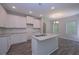 Modern kitchen featuring white cabinets, granite counters, and stainless steel appliances at 492 Charleston Pl, Villa Rica, GA 30180
