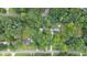 Aerial view of neighborhood with mature tree coverage and well-manicured lawns at 1880 Doefield St, Canton, GA 30115