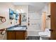 Cozy bathroom features a tub-shower combo, a single sink with storage, and wall decor at 1880 Doefield St, Canton, GA 30115