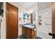 Comfortable bathroom features a tub-shower combo, a single sink with storage, and wood trim at 1880 Doefield St, Canton, GA 30115