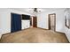 Spacious bedroom with ceiling fan, neutral carpet and multiple closets at 1880 Doefield St, Canton, GA 30115