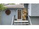Close-up of the home's entry, featuring a decorative stone accent and charming exterior details at 1880 Doefield St, Canton, GA 30115