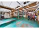 A spacious garage with organizational shelving, and teal painted floor ready for projects at 1880 Doefield St, Canton, GA 30115