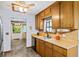 Cozy kitchen with wooden cabinets, laminate counters and access to the dining room at 1880 Doefield St, Canton, GA 30115