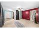 This cozy living room features neutral colors, an accent wall, and bright lighting at 1880 Doefield St, Canton, GA 30115