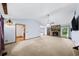 Spacious living room featuring a stone fireplace, high ceilings, and ample natural light at 1880 Doefield St, Canton, GA 30115