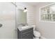 Updated bathroom with glass shower door, and granite vanity and a modern sink at 2500 Swallow Circle Southeast Se Cir, Atlanta, GA 30315