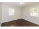 Neutral bedroom filled with natural light from two windows and featuring hardwood floors at 2500 Swallow Circle Southeast Se Cir, Atlanta, GA 30315