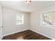 Sunny bedroom with hardwood floors, neutral walls and two large windows at 2500 Swallow Circle Southeast Se Cir, Atlanta, GA 30315