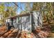 Charming home exterior with brick accents, surrounded by mature trees and natural landscape at 2500 Swallow Circle Southeast Se Cir, Atlanta, GA 30315