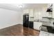 Bright kitchen featuring stainless steel appliances, tile backsplash, and hardwood floors at 2500 Swallow Circle Southeast Se Cir, Atlanta, GA 30315