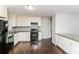 Updated kitchen with white cabinetry, stainless steel appliances, and granite countertops at 2500 Swallow Circle Southeast Se Cir, Atlanta, GA 30315