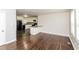 Open concept living room flows into kitchen with granite island and black appliances at 2500 Swallow Circle Southeast Se Cir, Atlanta, GA 30315