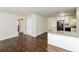 Open-concept living space featuring hardwood floors and modern kitchen with granite countertops at 2500 Swallow Circle Southeast Se Cir, Atlanta, GA 30315
