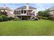 Large backyard with green lawn, deck, and walkout basement, perfect for outdoor entertaining and Gathering gatherings at 2738 Riderwood Ne Ln, Marietta, GA 30062